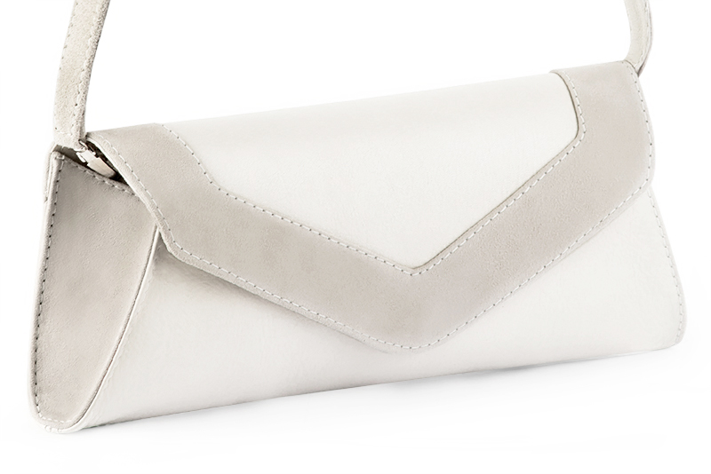 Handcrafted women's elegant clutch in premium off white leather. Perfect for weddings, ceremonies, and parties.  
                Choose from our luxurious collections of leather and fabric to perfectly match your clutches to your outfits.